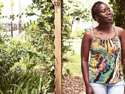 Hurricane Katrina survivor Sherry Thomas stands in a garden in New Orleans, Louisiana.