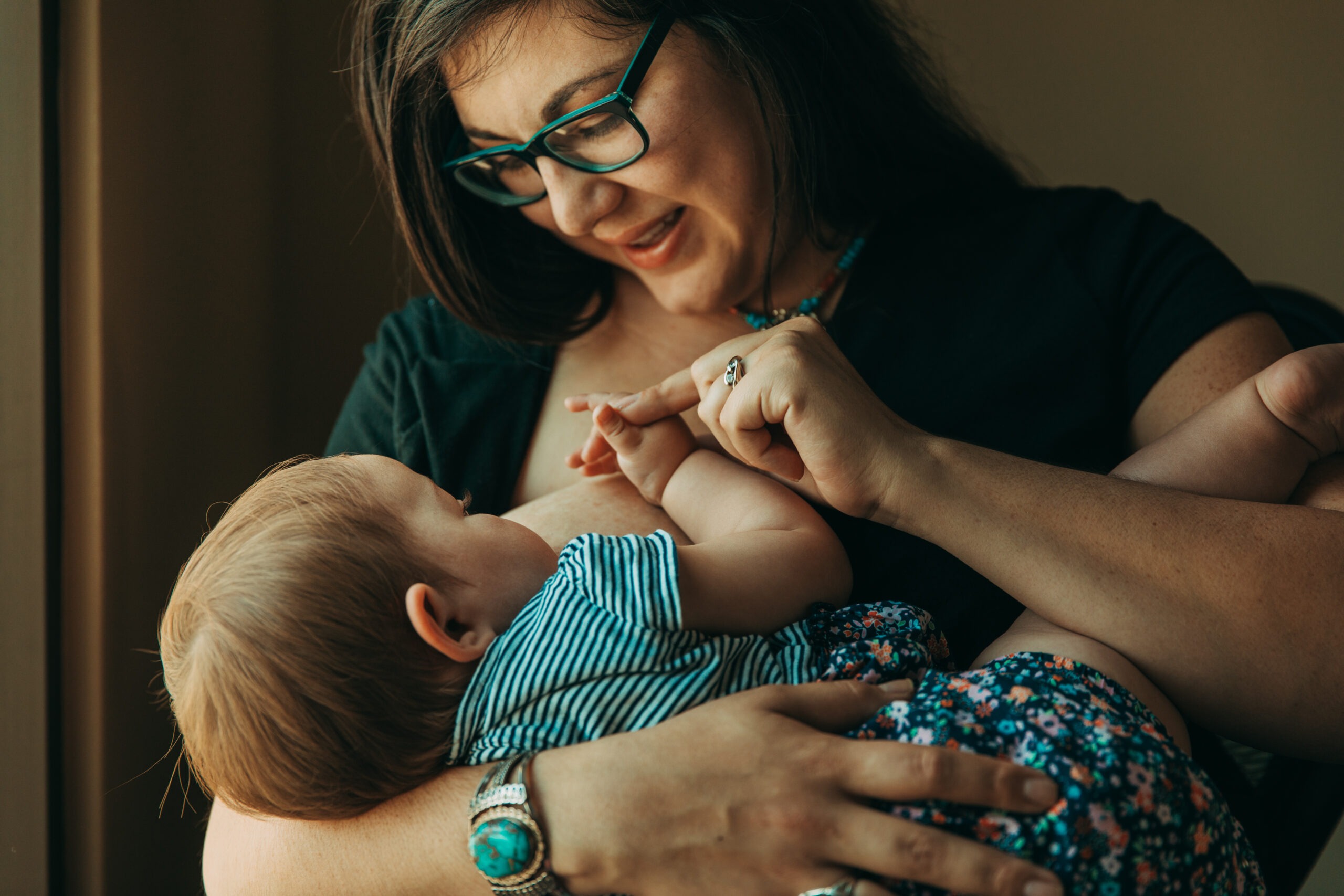 Close up of a mother breastfeeding her child.