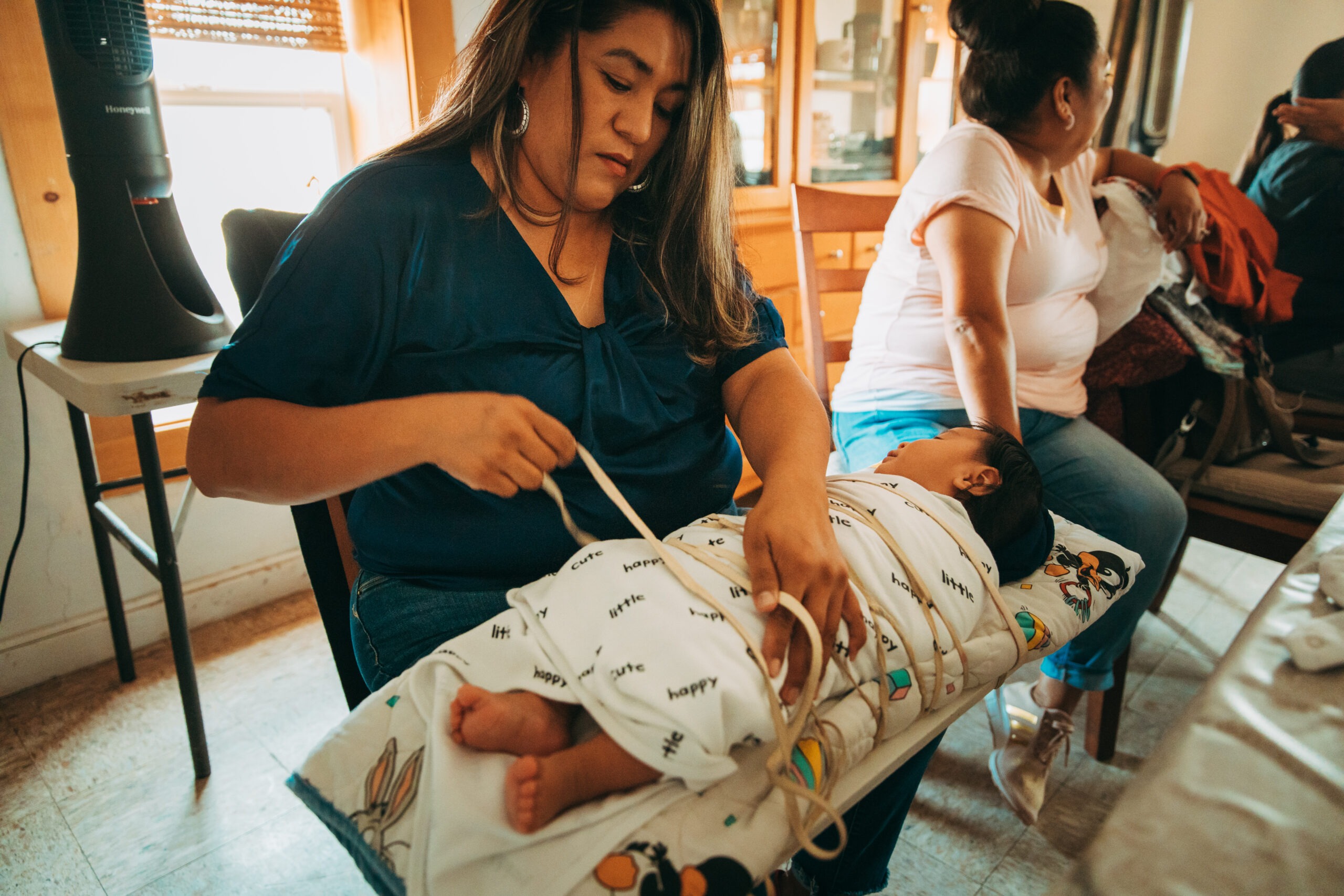 Breastfeeding mother in New Mexico tending to her child.