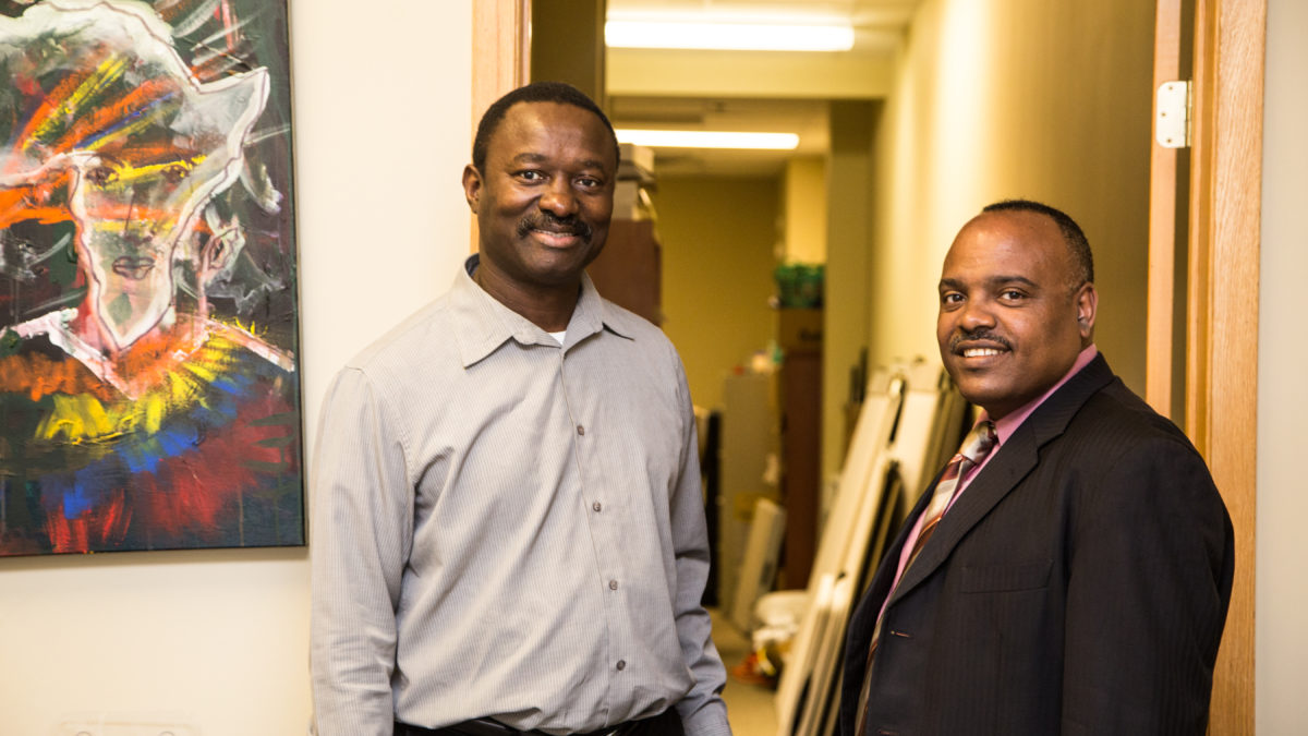 Gene Gelgelu, executive director of African Economic Development Solutions, with a staff member at the office.