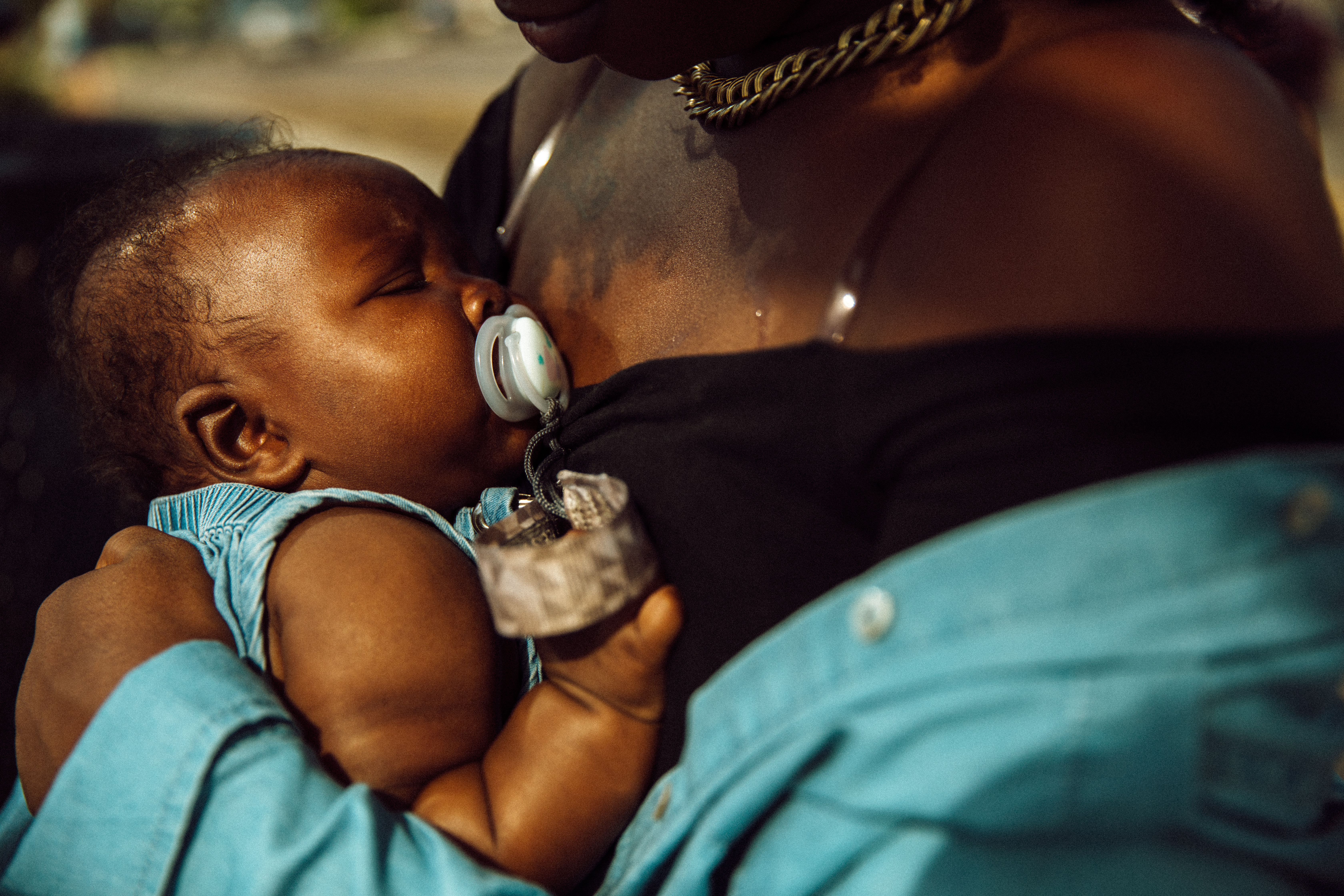Janel Vee holding her infant daughter.