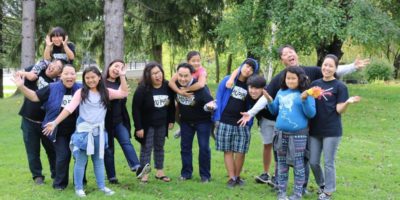 A group of Hmong Americans from the Bad Mo Pho Phamily (BMPP) Giving Circle outside. Giving circles are a new model in organized philanthropy