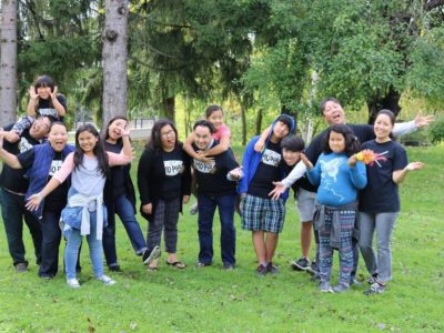 A group of Hmong Americans from the Bad Mo Pho Phamily (BMPP) Giving Circle outside. Giving circles are a new model in organized philanthropy