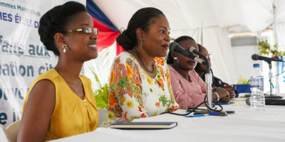Didi Bertrand and Gisèle Umuhumuza speaking on a panel at the 2019 Forum of Haitian Women Elected Officials.