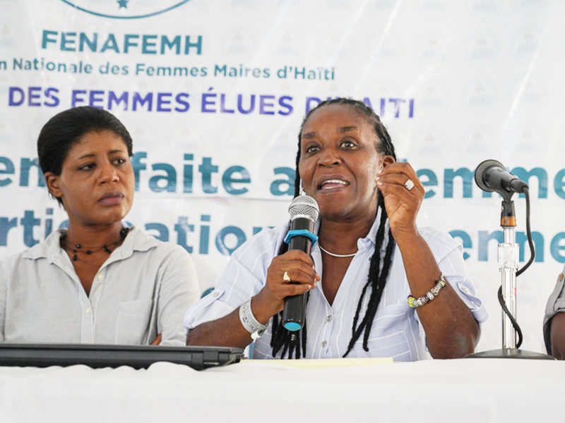 Josette Macillon and Marie-Ange Noel speaking on a panel at the 2019 Forum of Haitian Women Elected Officials.