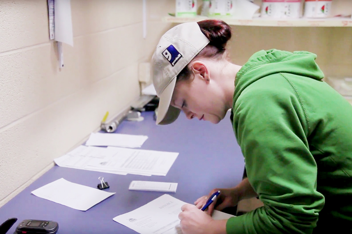 Farm to Freezer employee and 2016 GOOD Growth Award recipient, Trish, prepares order forms for local retailers. Photo: Farm to Freezer.