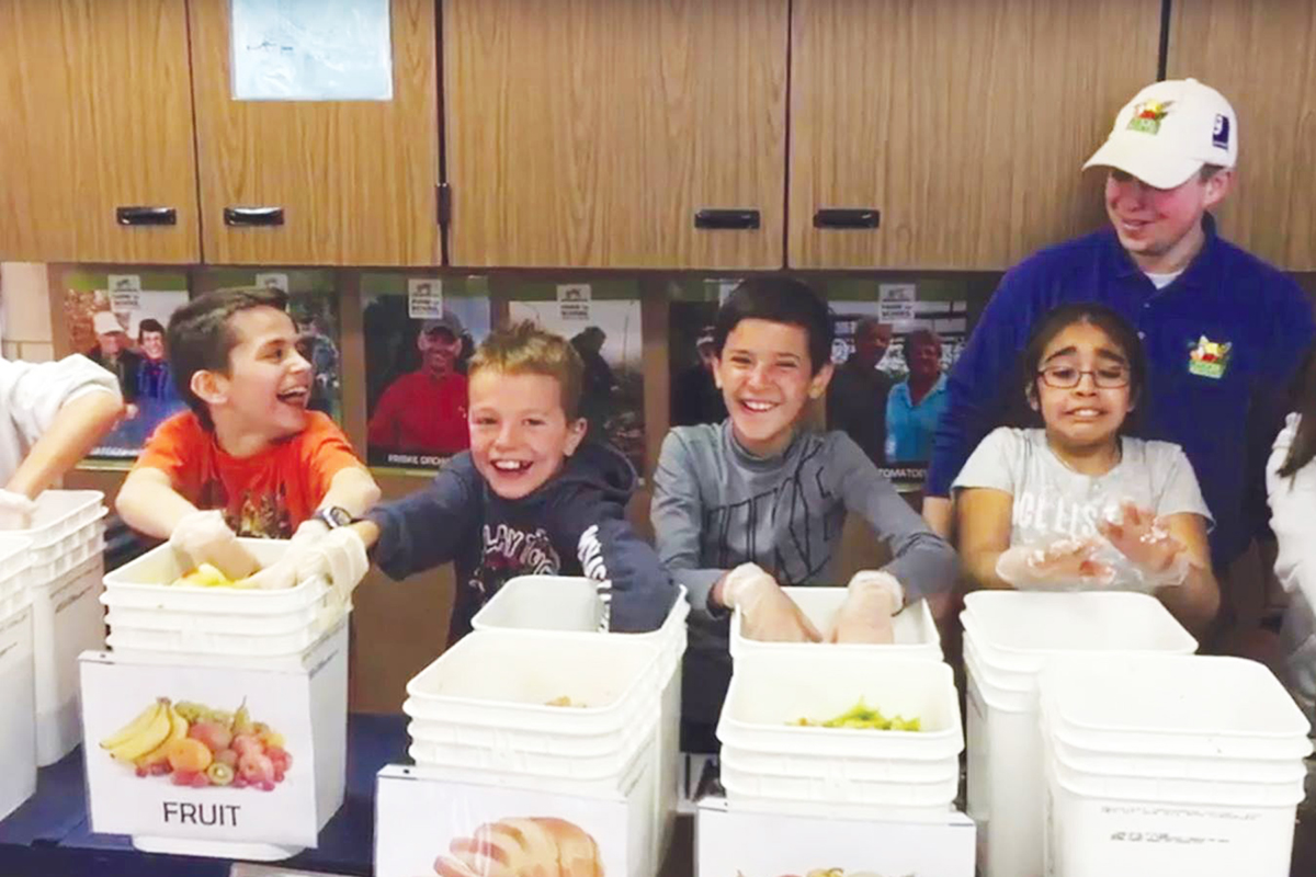 Goodwill Food Rescue Manager Taylor Moore visits Eastern Elementary school in Traverse City, Michigan to educate students on food waste and the benefits of eating local good food year round. Photo: Farm to Freezer.