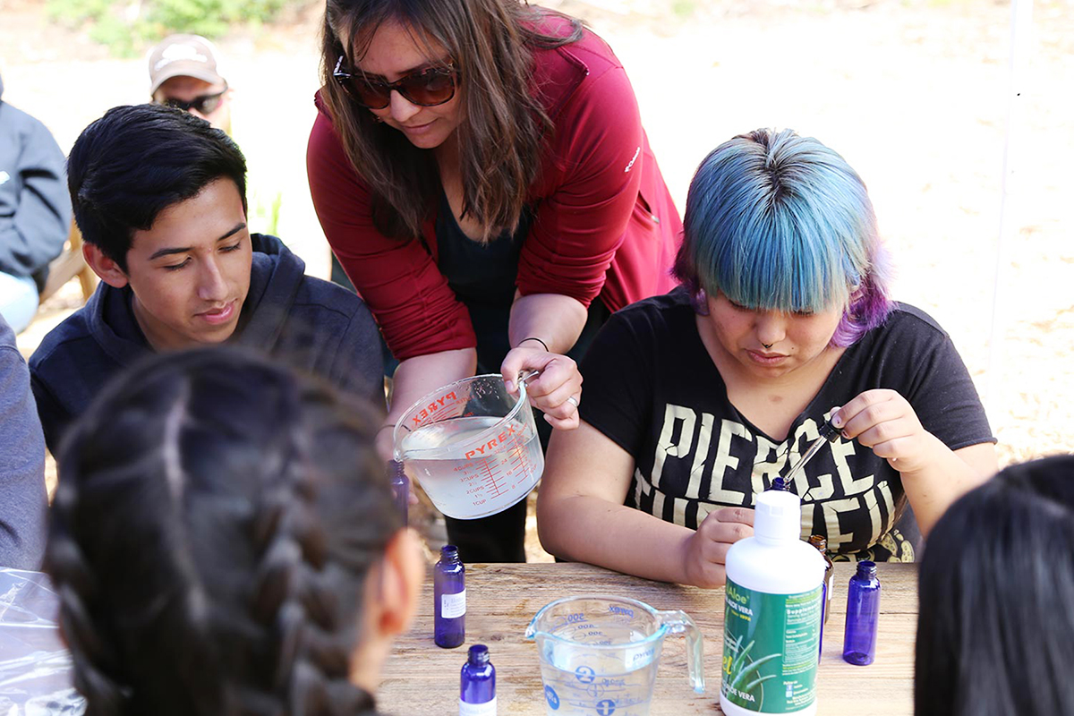 Valerie Segrest teaches Muckleshoot youth about traditional medicine, helping them connect to their Native heritage. Photo: Valerie Segrest.