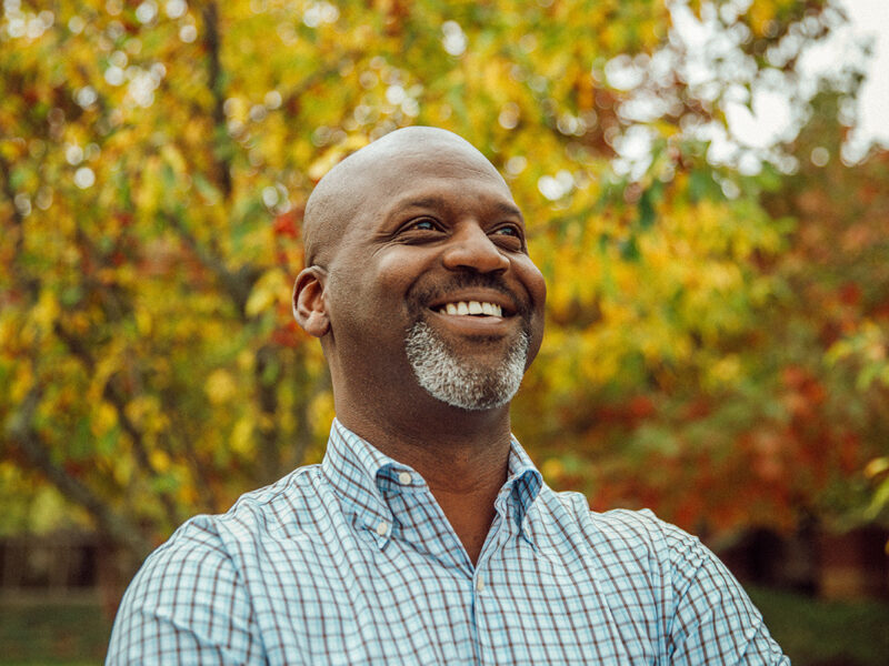 smiling man representing mission driven investing managers