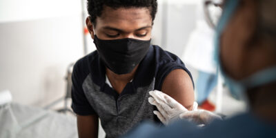 Young man being vaccinated