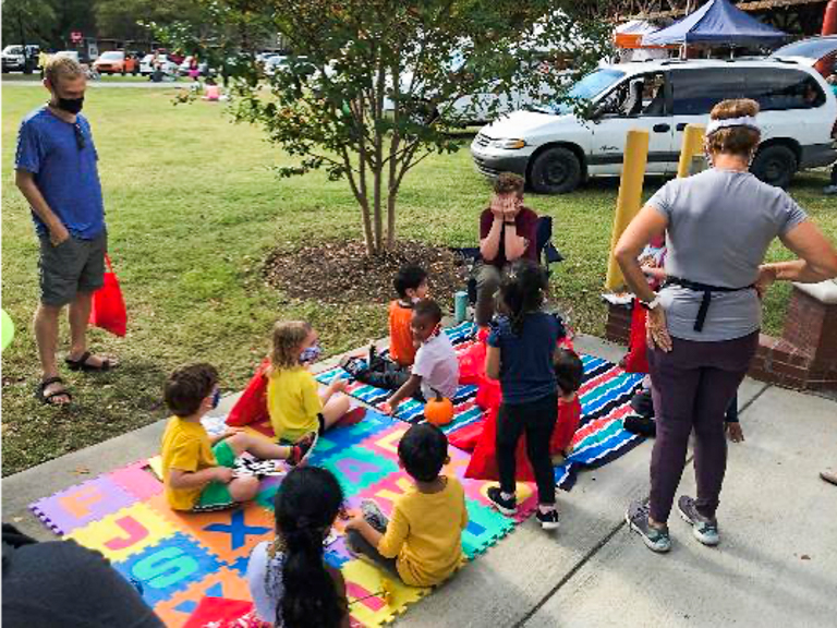 A group of kids gather outside at the local farmers’ market in Orange County, NC. Photo courtesy of CEFS.
