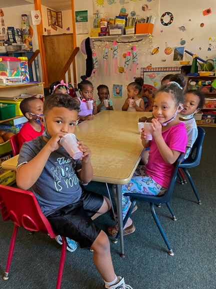 Classmates at Sanford Child Care Center sit around the table, enjoying their homemade smoothies in Lee County, NC. Photo courtesy of CEFS.