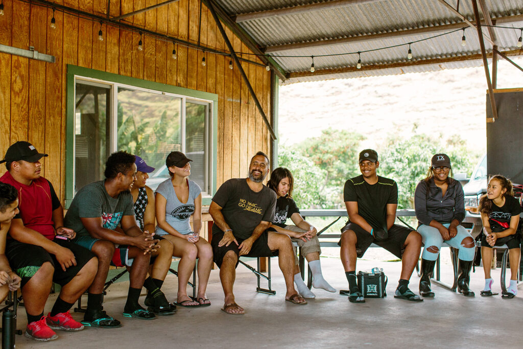 The MA’O Organic Farms team meets to plan their work day.