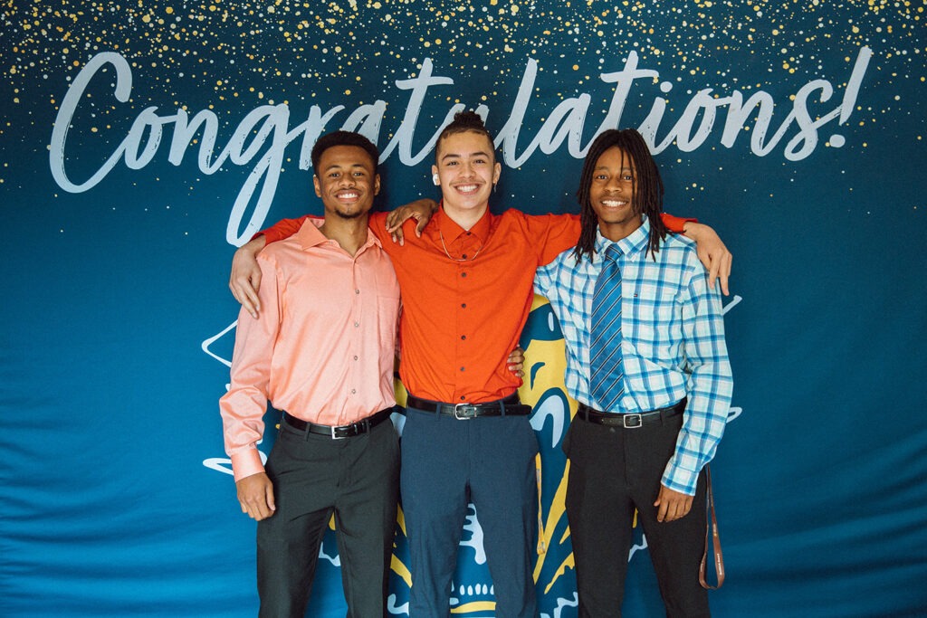 Tristen Jackson, middle, poses with two other Bearcats on Decision Day.