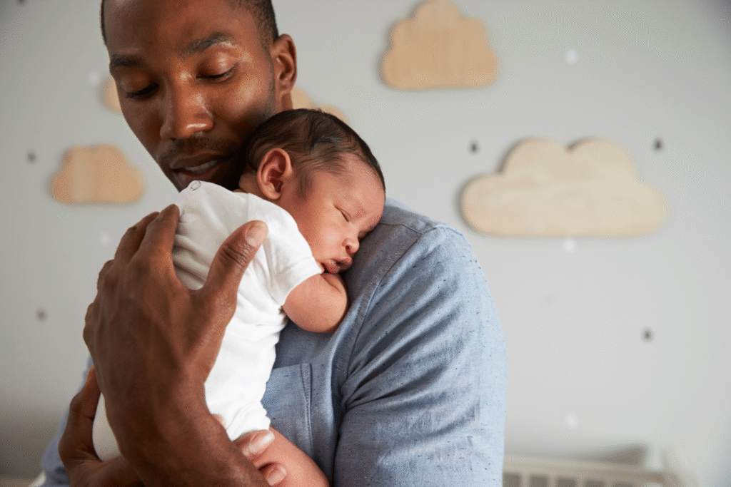 father holding baby | W.K. Kellogg Foundation