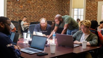 MCA students and instructors work through a coding problem together. Courtesy of Mississippi Coding Academies.