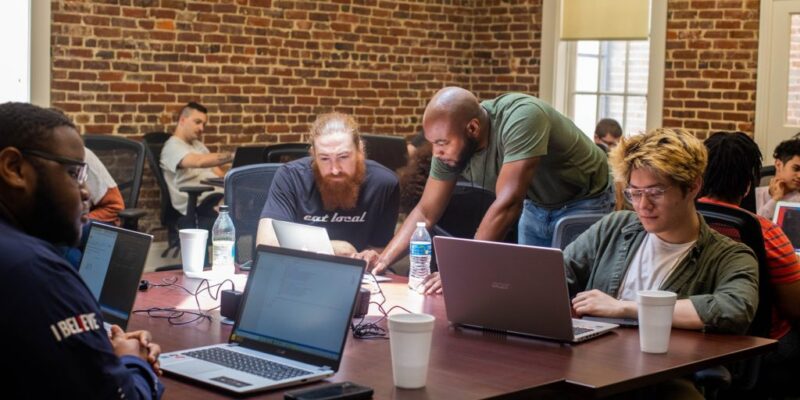 MCA students and instructors work through a coding problem together. Courtesy of Mississippi Coding Academies.